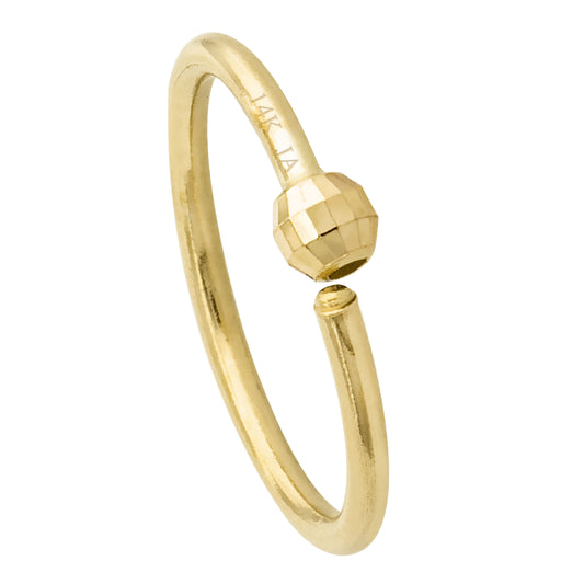 Gold nose ring with a beaded design on a white background